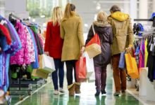 Family carrying shopping bags in mall
